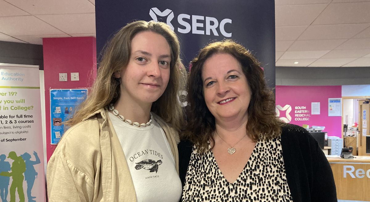 Erin Horner with her mother Alison, both smiling to camera and pictured with SERC Reception area in background. 